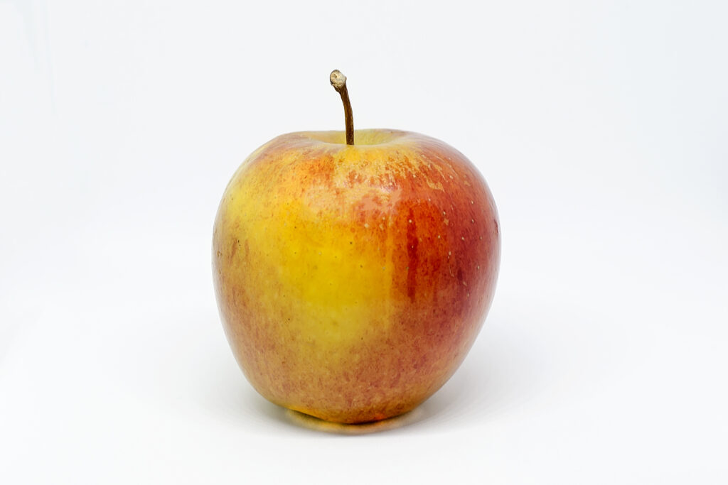 Image of a ripe apple on a surface